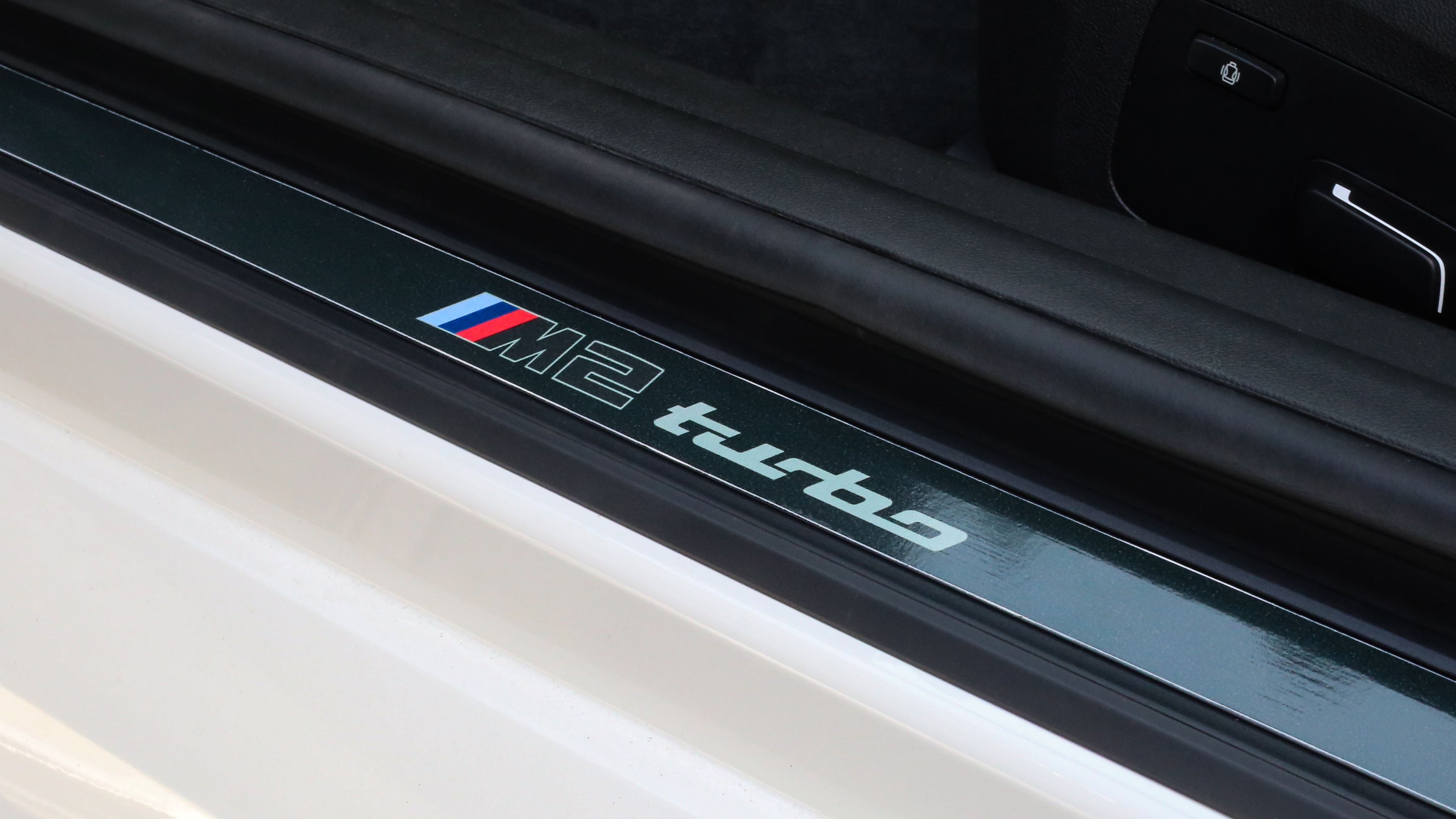 Close-up of the BMW M2 Turbo Design Edition's engine, highlighting its performance capabilities.