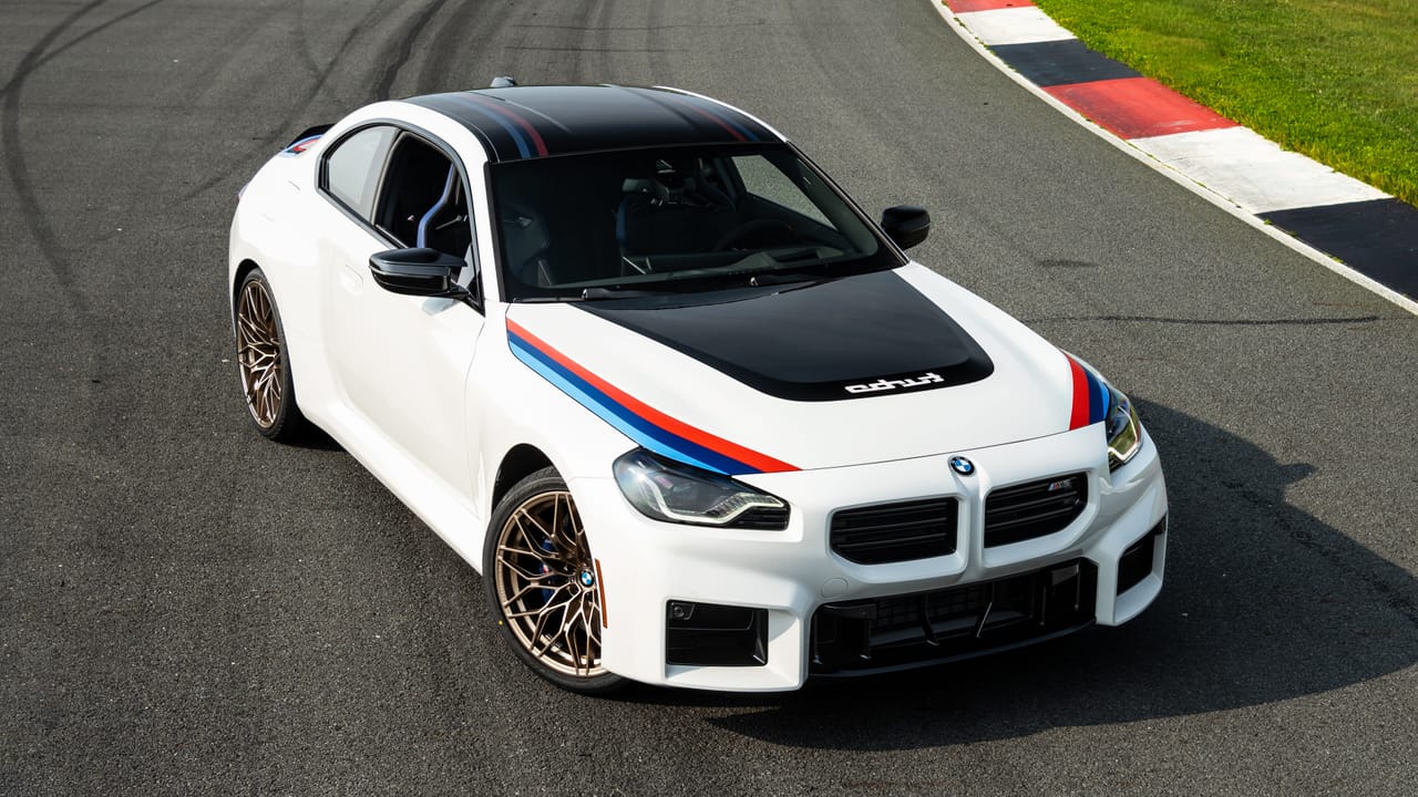 BMW M2 Turbo Design Edition in Alpine White, showcasing the iconic M stripes.