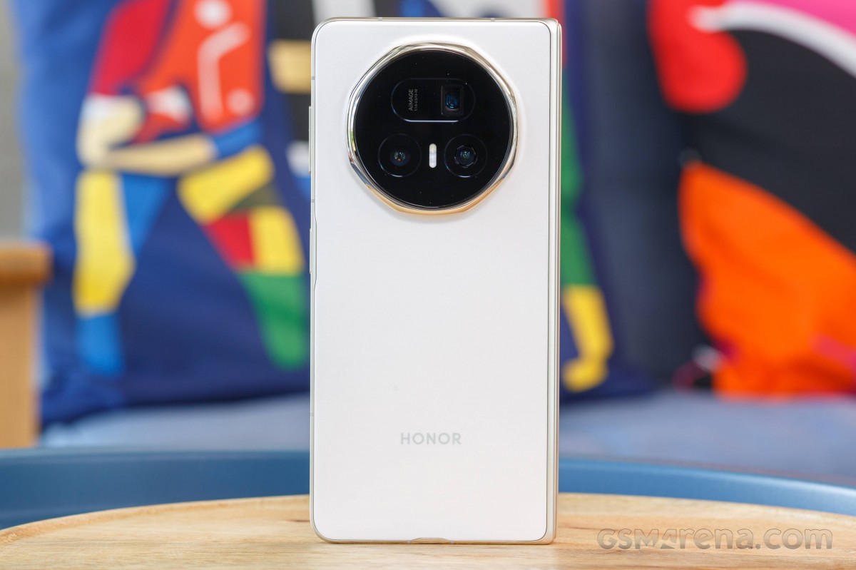 The Honor Magic V5 folded, showing the cover display