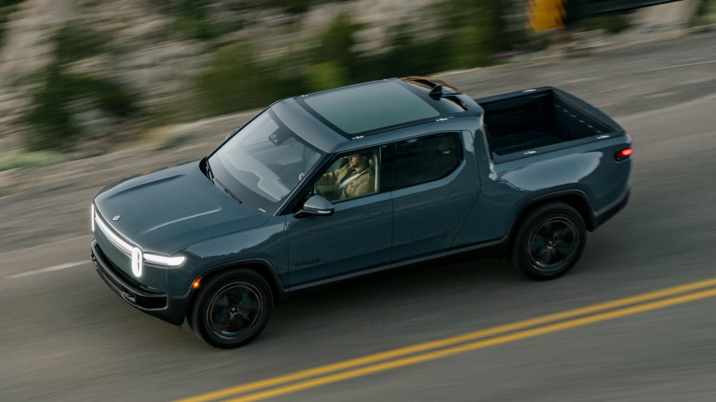 Rivian R1T showcasing its versatility in various scenarios