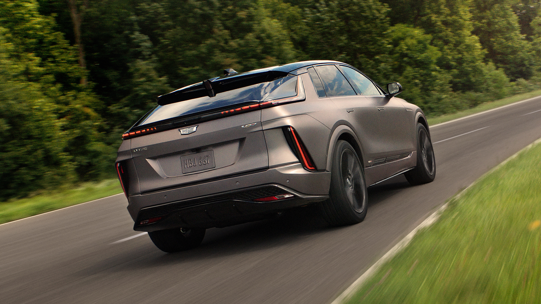 Side profile of the Cadillac Lyriq V-Series showcasing its aerodynamic silhouette Side profile of the Cadillac Lyriq V-Series showcasing its aerodynamic silhouette