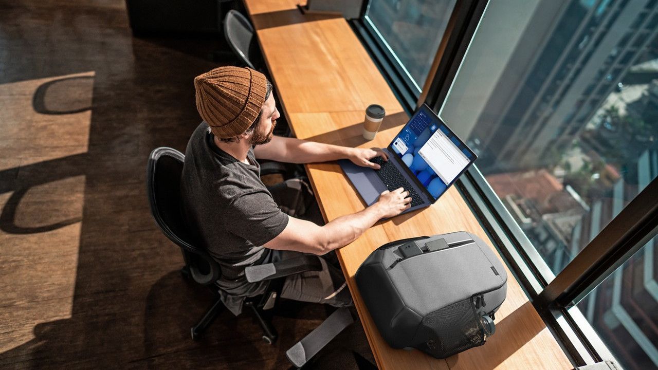 Dell Plus laptop on a modern desk, showcasing its sleek design and usability.