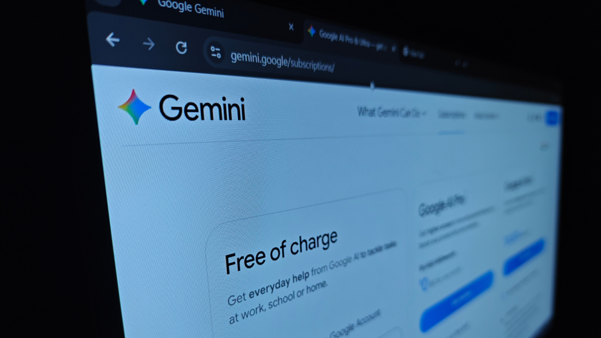 A student happily using a laptop, indicating access to Google AI Pro