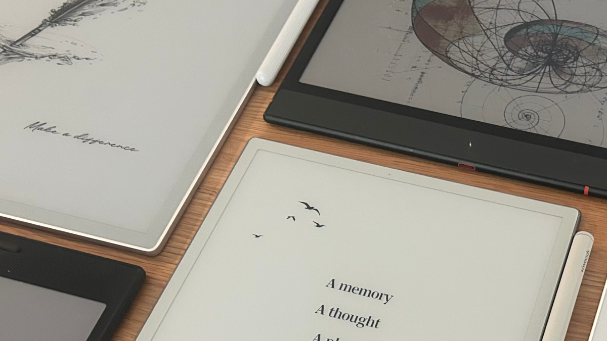 Digital notebooks displayed on a table with pens and accessories during Black Friday