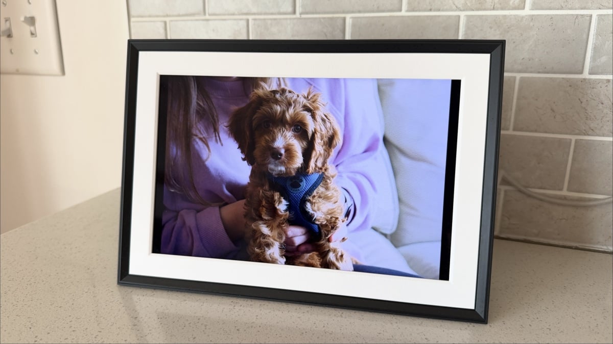 Aura Carver Mat digital picture frame displaying family photos Aura Carver Mat digital picture frame displaying family photos