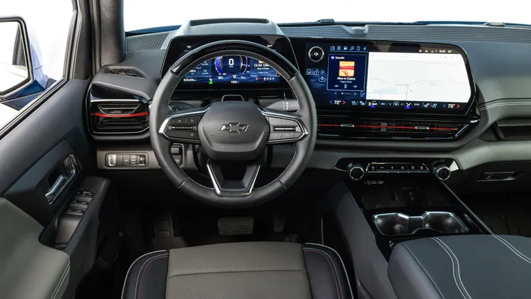 Chevrolet Silverado EV Trail Boss Off-Road Challenges A Chevrolet Silverado EV Trail Boss struggling to navigate a moderately challenging off-road obstacle, indicating potential limitations in its off-road prowess.