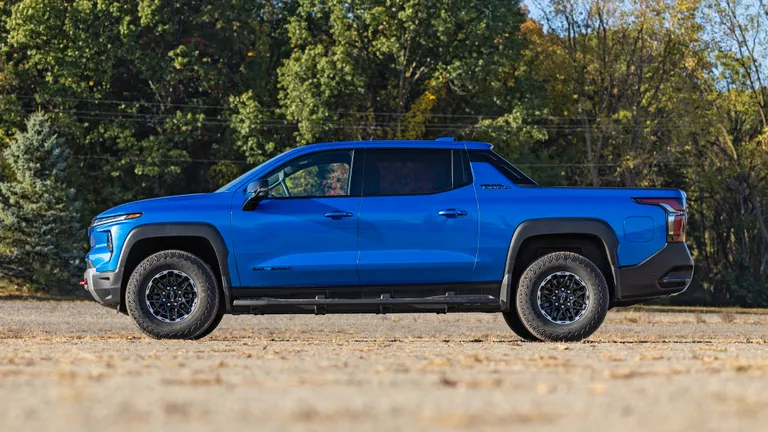Chevrolet Silverado EV Trail Boss On-Road Comfort The front three-quarter view of the Chevrolet Silverado EV Trail Boss on a highway, demonstrating its smooth on-road presence.
