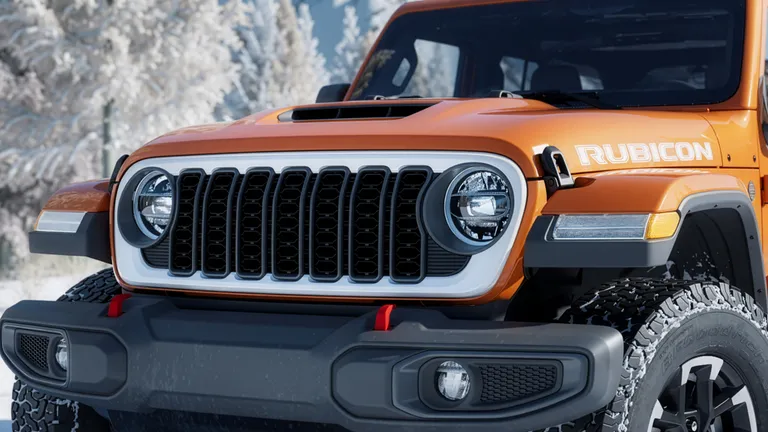 Interior view of the 2026 Jeep Wrangler Whitecap, showing modern controls and comfortable seating, contrasted with its rugged exterior persona.