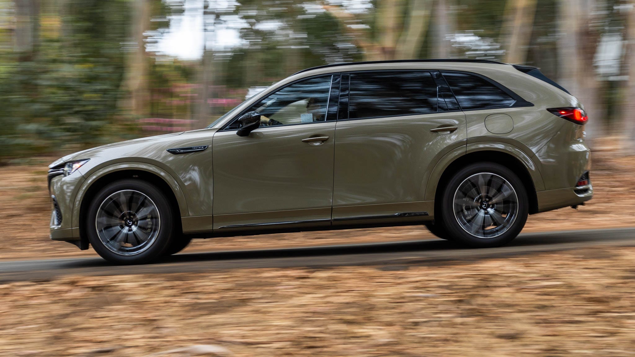 A driver's perspective inside a Mazda CX-70, with focus on interior panels that may be the source of rattles and squeaks.