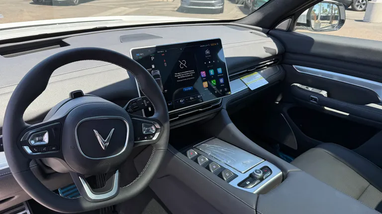 VinFast VF9 charging at an EV station