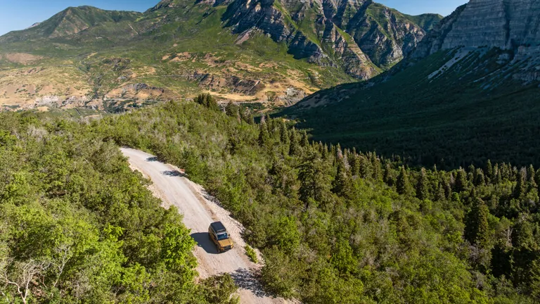 The 2025 Toyota Land Cruiser resting at a scenic overlook, reflecting the vastness of the Alaskan wilderness during the 8,000-mile expedition.