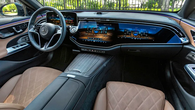 Mercedes-Benz E450 All-Terrain Wagon cruising on an open highway, suggesting long-distance travel.