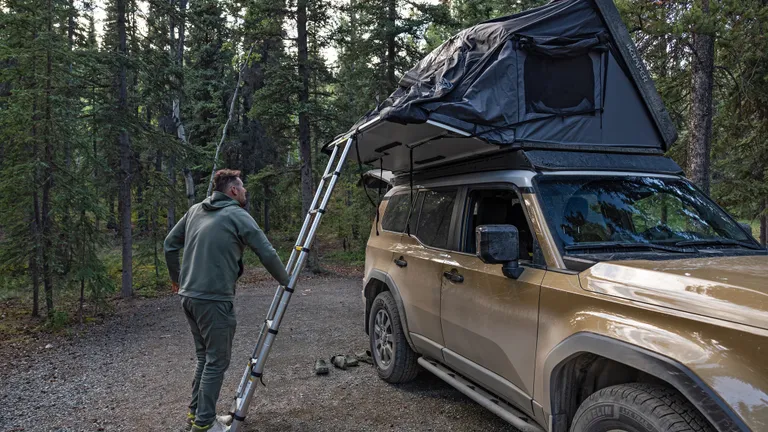 Spacious interior of the iKamper Skycamp DLX rooftop tent with comfortable mattress and windows