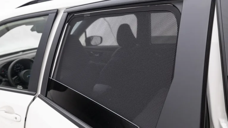 Spacious Subaru Forester cargo area with an all-weather liner and pet divider, ready for travel with a dog crate.