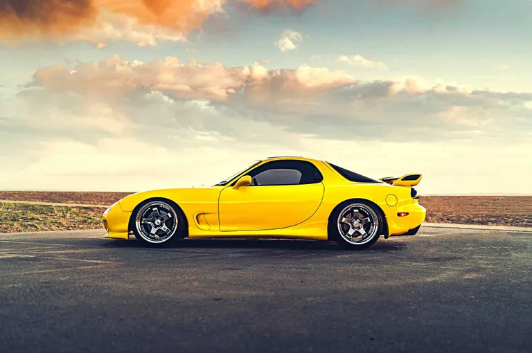 A classic Ferrari sports car, known for its beauty and complex maintenance needs