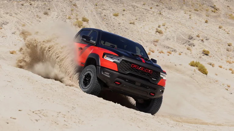 The 2027 Ram TRX in an action shot, demonstrating its off-road capabilities and imposing presence.
